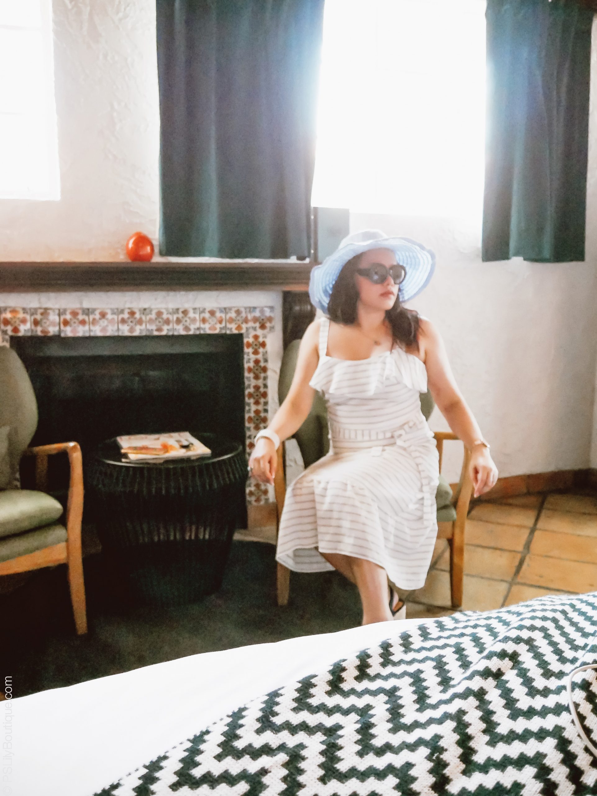 PSL_Palm_Springs-fireplace-chairs-table-dress-hat-sunglasses-shoes-1