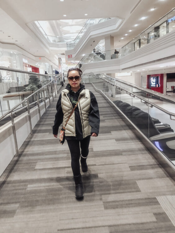 pslilyboutique-on-instagram-pinterest-beige-gold-the-north-face-down-puffer-vest-black-merrell-encore-4-boots-chanel-sunglasses-under-armour-black-hoodie-spring-2025-outfit-ideas-IMG_4523 2